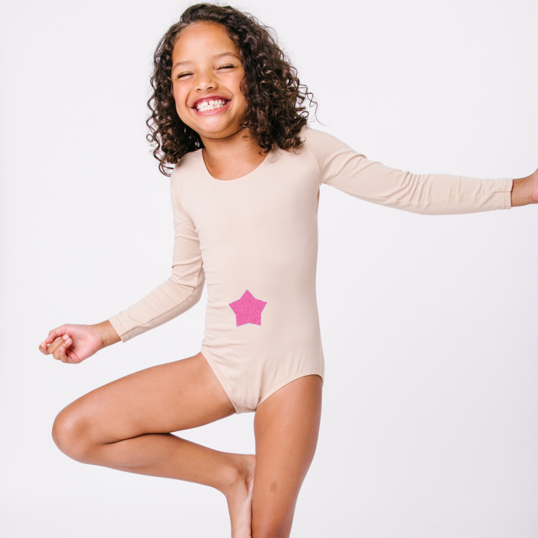 Nude leotard on little girl model with neon pink glitter Troll star design.