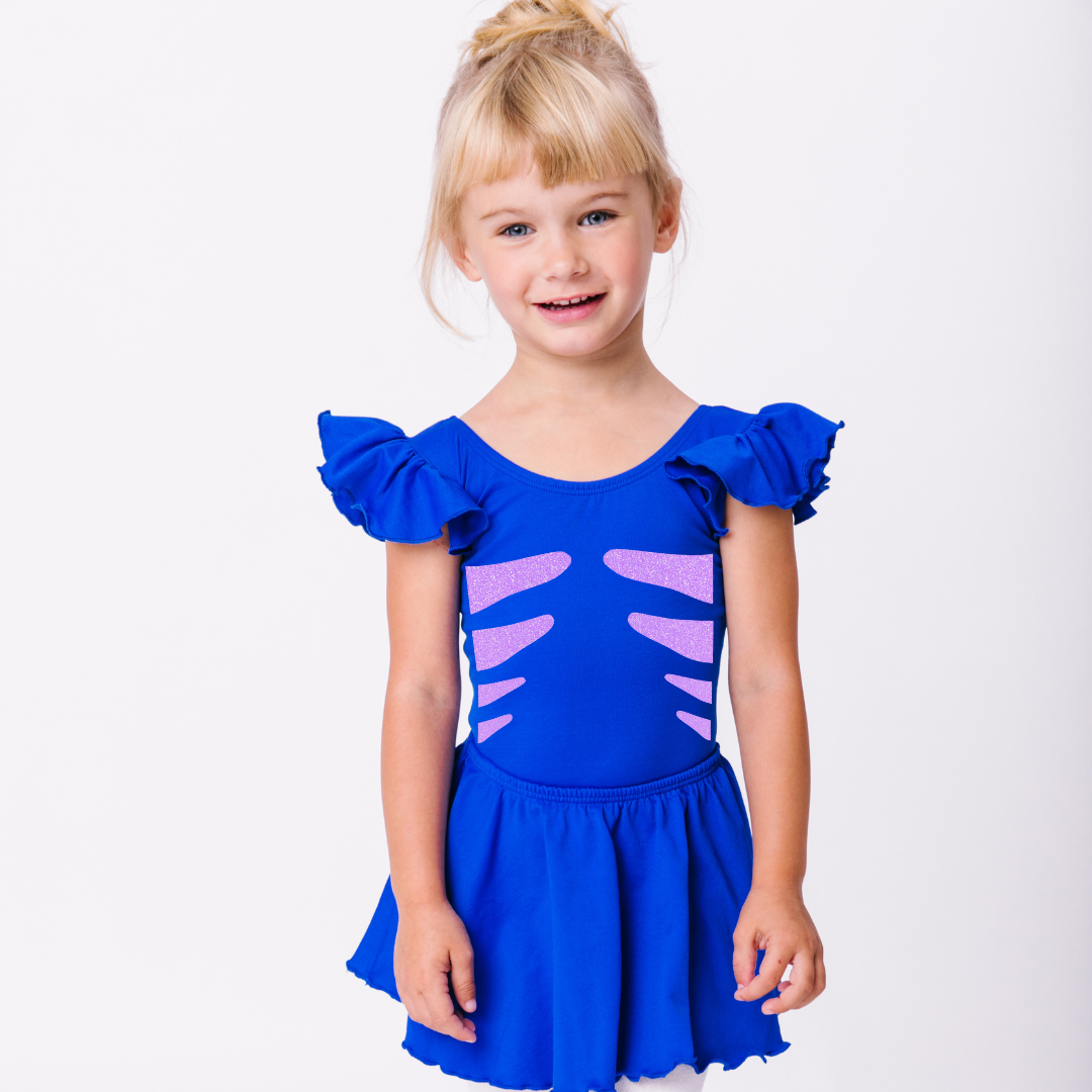 Little girl model with Royal Blue ruffle leotard and neon purple glitter fish design.